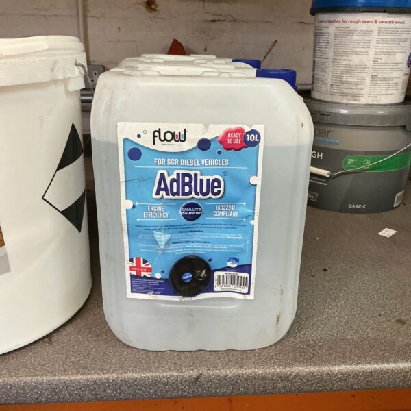 Two containers of Flow AdBlue diesel exhaust fluid for vehicle emissions reduction.