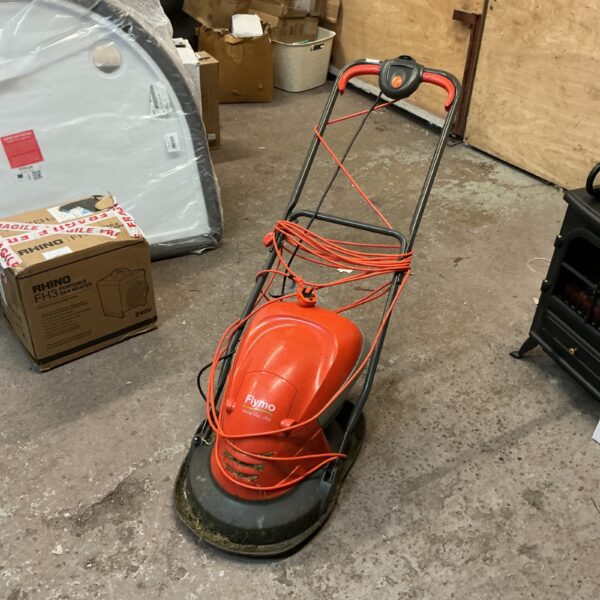 Vintage Flymo hover mower for garden maintenance.