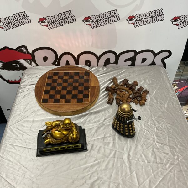 Wooden folding chess set with Doctor Who Dalek and Buddha figure.