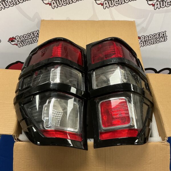 Ford Ranger T8 rear lights with black guards for sale.