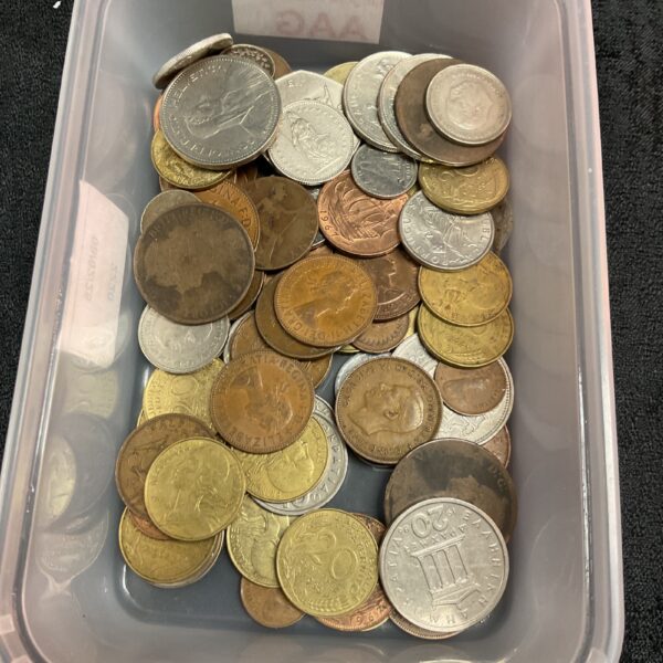 Mixed lot of foreign coins for collectors and currency enthusiasts.