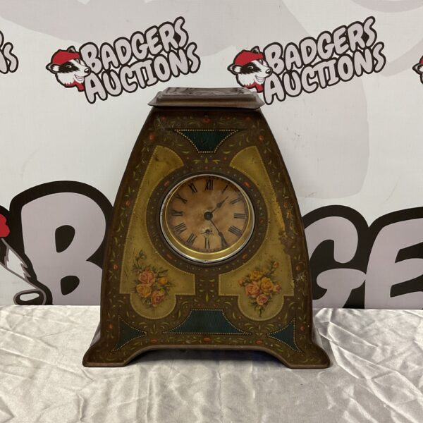 Antique Fryer & Co Victory V mantle clock with floral design.