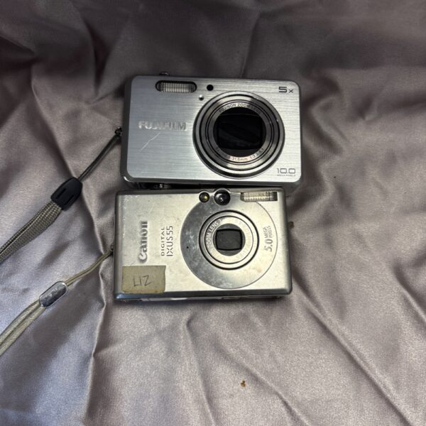 Silver Fuji film and Canon digital cameras, vintage point and shoot.