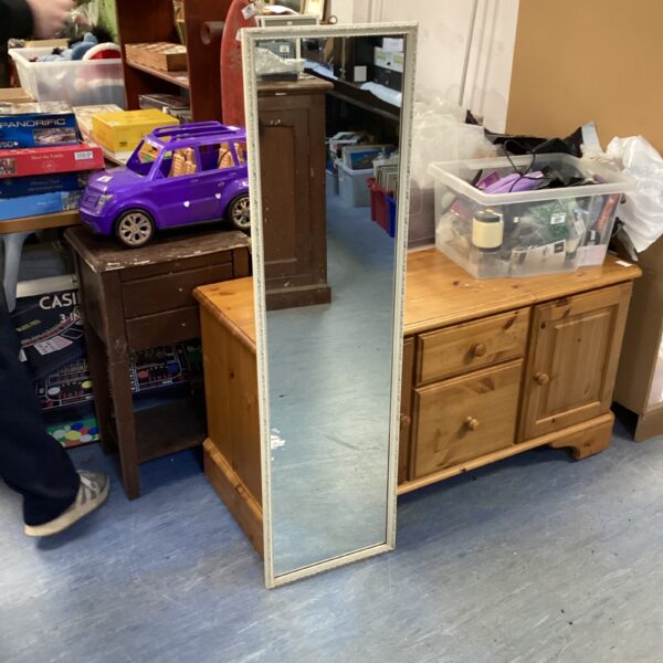 Vintage full length wall mirror in a room setting.