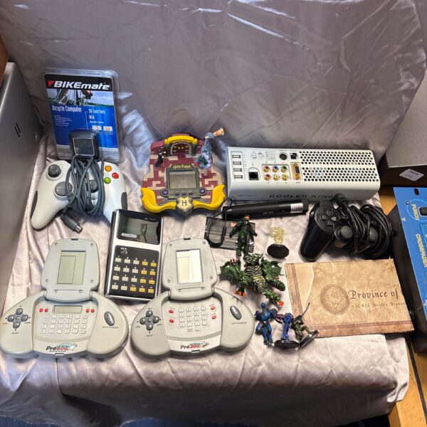 Mixed lot of vintage gaming handhelds and controllers, including BikeMate.