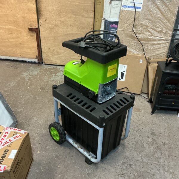 Side view of a green and black garden wood chipper with wheels.