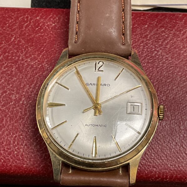 Vintage Garrard 9ct gold wristwatch with cream dial.