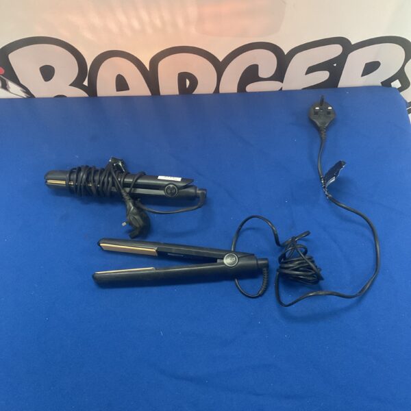Two GHD Original hair straighteners with black casing and power cords.