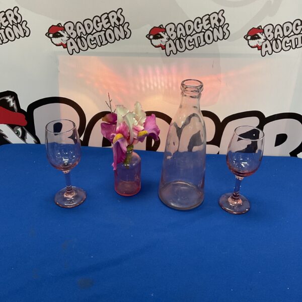 Clear glassware collection featuring wine glasses, a carafe, and a vase.