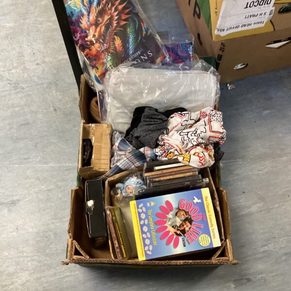 Mixed lot featuring the *Good Life* DVD box set, CDs, and shirts.