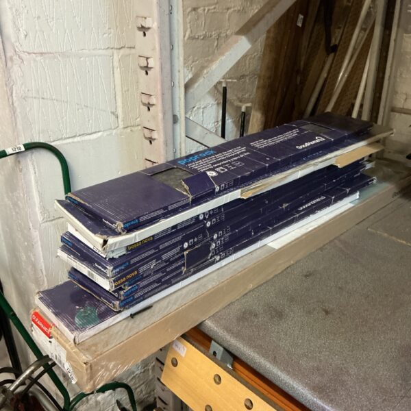 Stack of Goodhome vinyl floor tile packs for DIY projects.