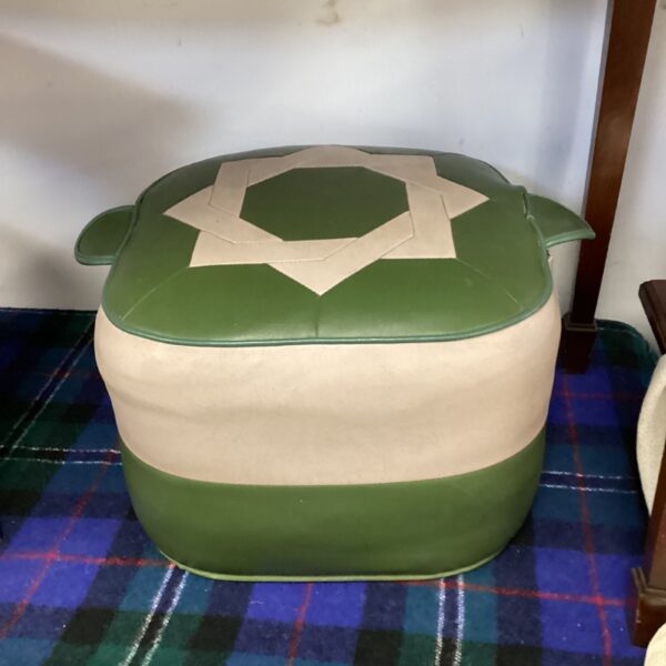 Vintage green leather footstool with white panel.