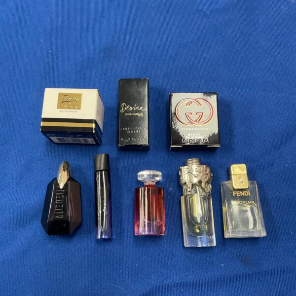 Miniature perfume tester lot including Gucci and Dolce & Gabbana fragrances.