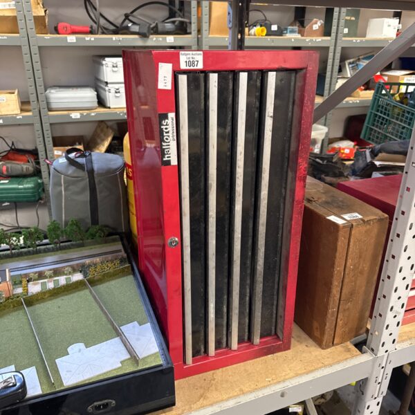 Red Halfords professional tool chest for garage and workshop storage.