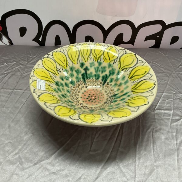 Vibrant hand-painted ceramic bowl with floral design.
