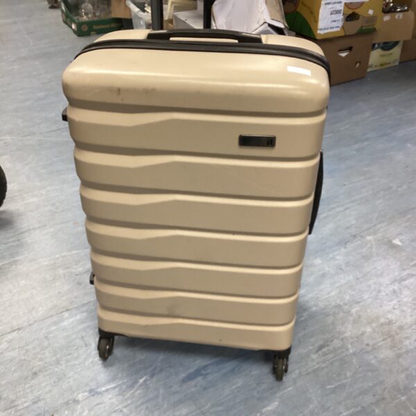Grey hard shell wheeled suitcase for travel and holidays.