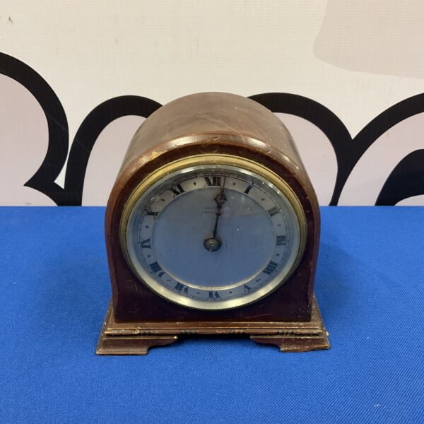 Vintage Harrods mantle clock with beehive shape and Roman numerals.