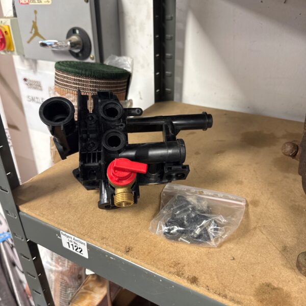Black heating flow pump assembly with red lever.