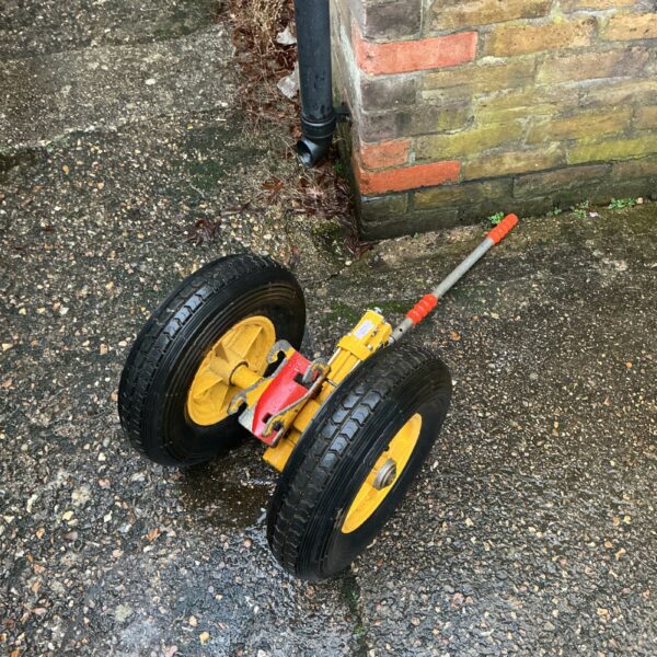 Close-up of a helicopter towing cart with pneumatic tyres.