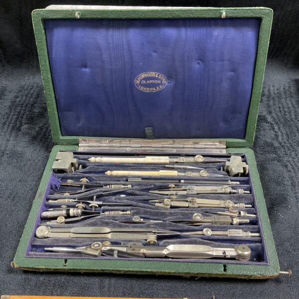 Antique Horwood and Sons drawing instrument set in open mahogany case.