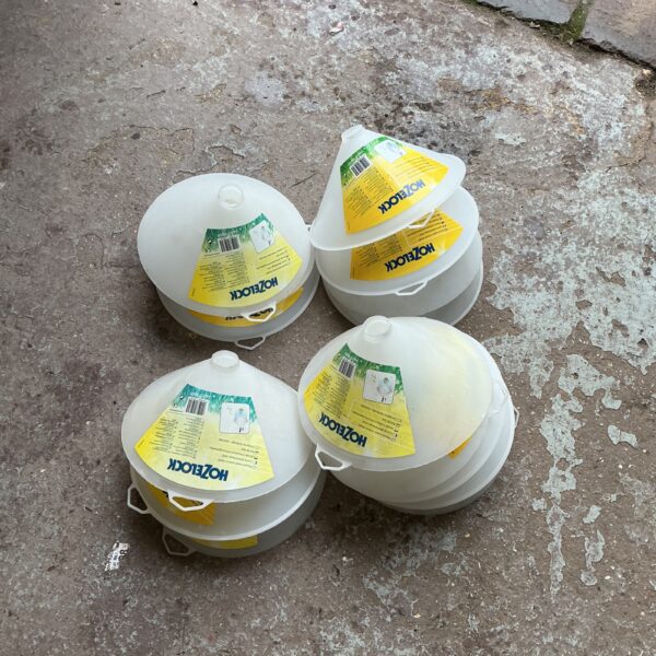Lot of Hozelock weed shields for garden plant protection.