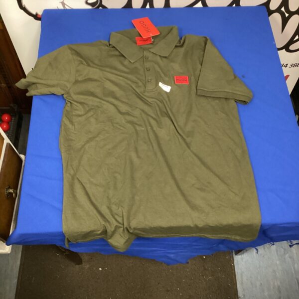 New green Hugo Boss polo shirt size XL with tags.