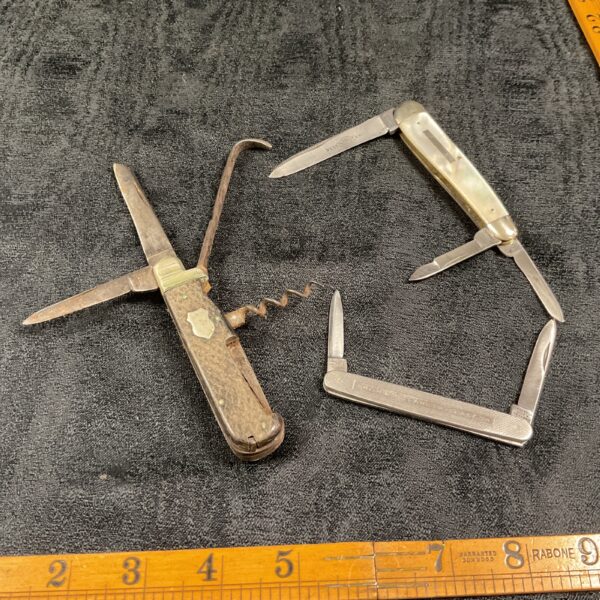 Three vintage pocket knife, including a nest knife and a Winfield multitool knife