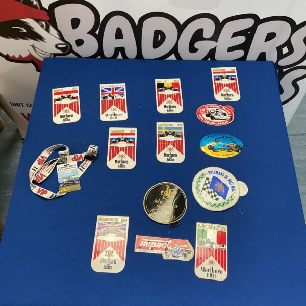 Collection of classic Grand Prix stickers and badges