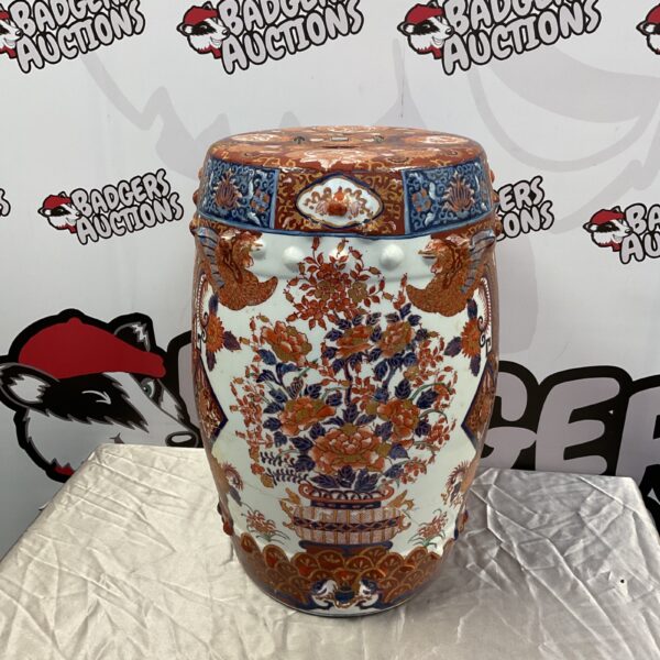 Vibrant Imari porcelain stool with detailed floral design.