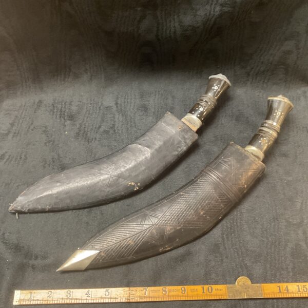 Pair of antique Indian Kukri knives in their sheaths.