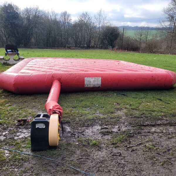 Large inflatable crash mat for gymnastics and training.
