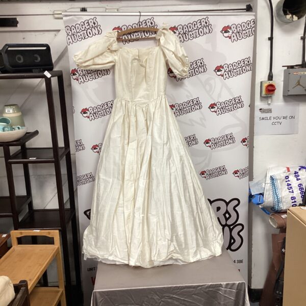 Vintage ivory wedding dress with lace detailing.