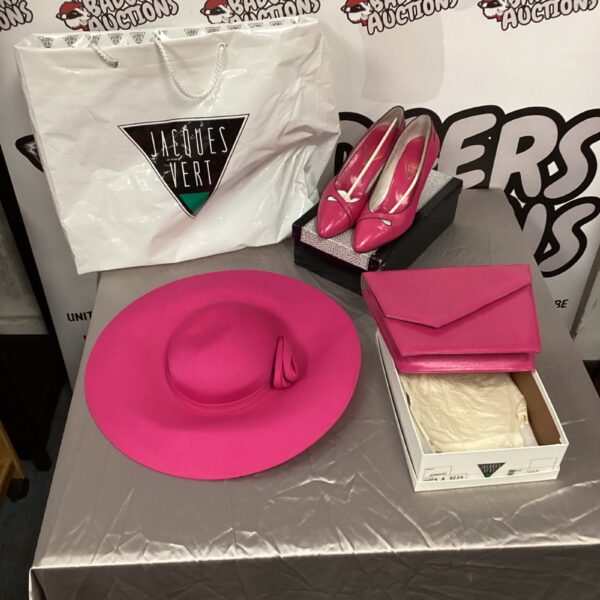 Jacques Vert pink hat, heels, and purse set on display.