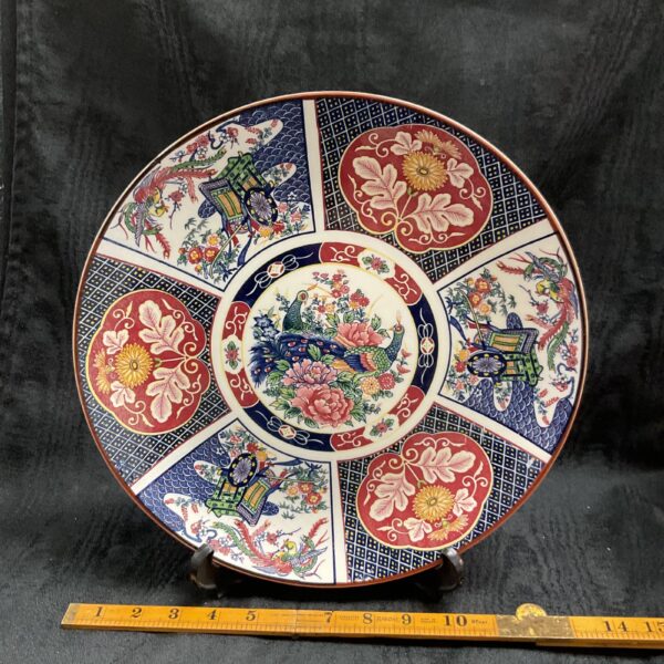 Antique Japanese Imari plate with birds and foliage design.