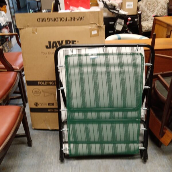 Patterned Jay Be folding guest bed for space saving accommodation.