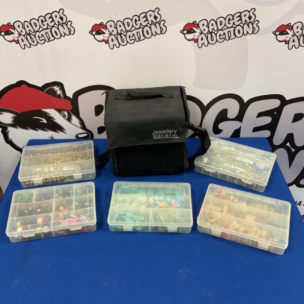 Jewellery making case with gemstone beads and five trays.