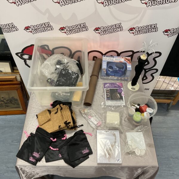 Assortment of jewellery making supplies including pouches and tools.