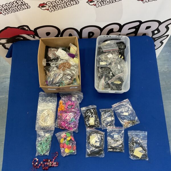 Mixed lot of colourful jewellery making supplies and beads.