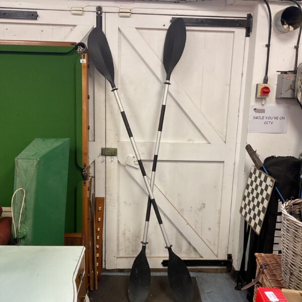 Pair of used kayak paddles with aluminium shafts and plastic blades.