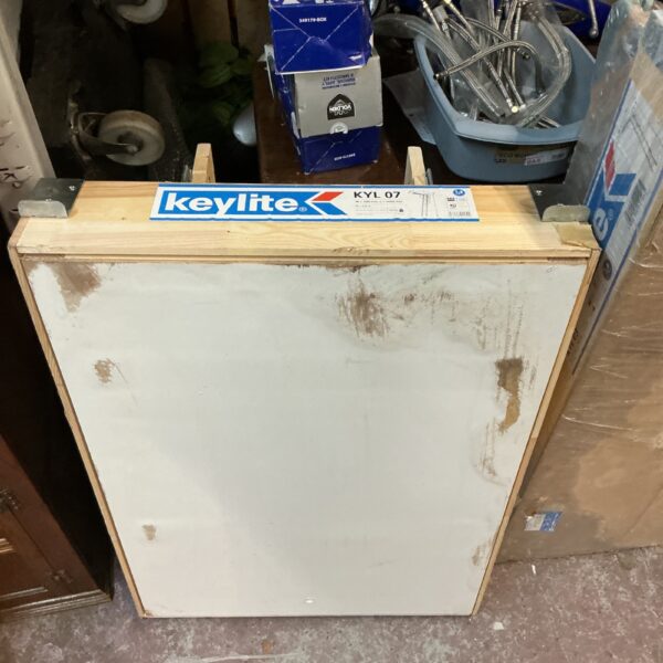 Keylite wooden loft hatch for attic access, showing signs of wear.