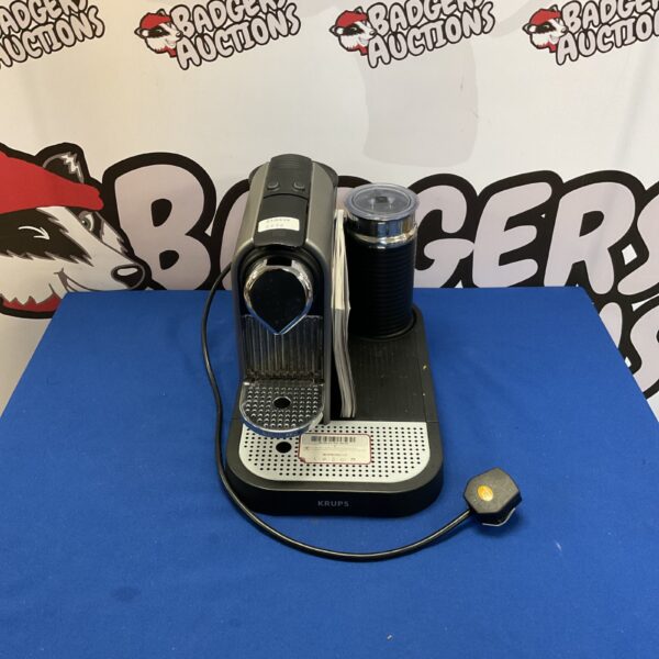 Black Krups Nespresso machine for convenient coffee brewing.