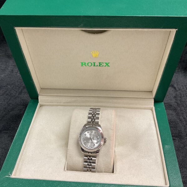 Silver-tone ladies reproduction digital wristwatch in a presentation box.