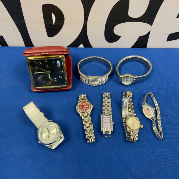 Vintage ladies wrist watches and a Jungens travel alarm clock lot.