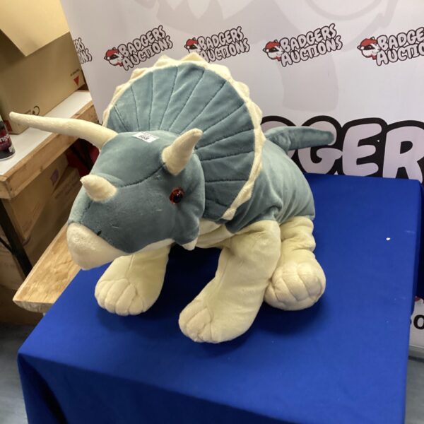 Large green Stegosaurus plush toy for collectors.