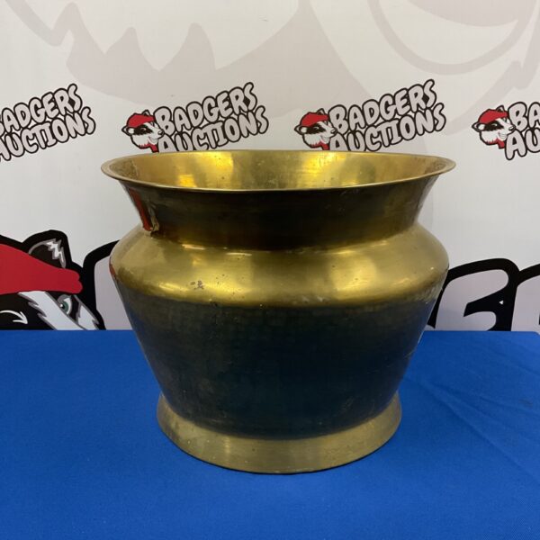 Large hammered brass pot with traditional texture.
