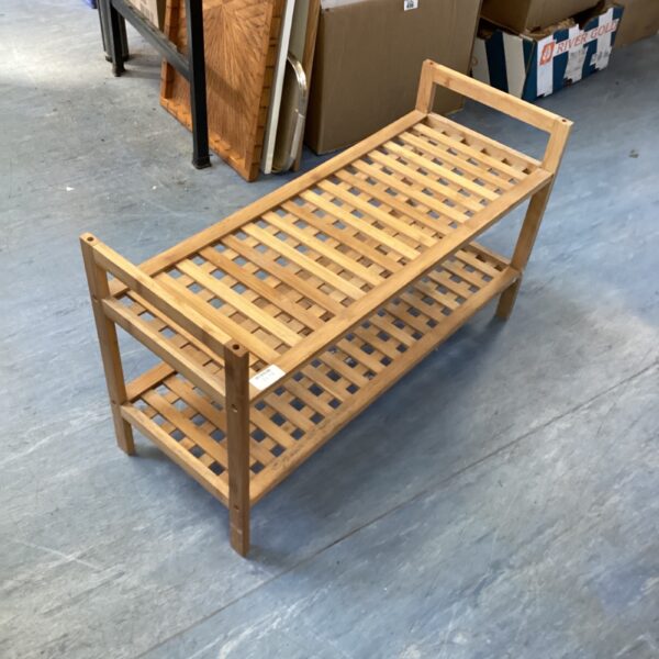 Wooden lattice shoe rack for entryway organization and storage.