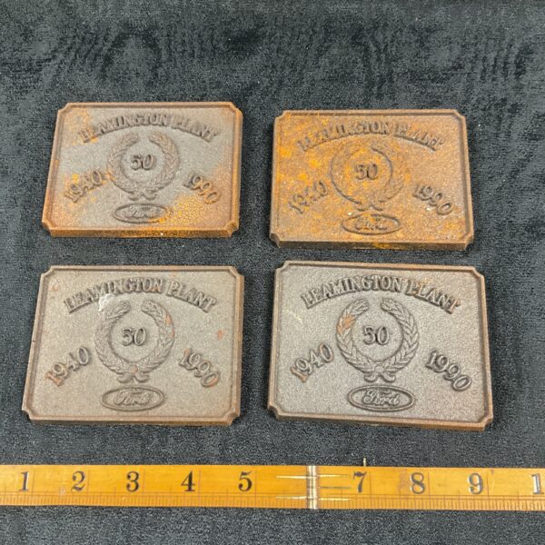 Vintage cast iron Leamington Plant Ford plaques commemorating 50 years.