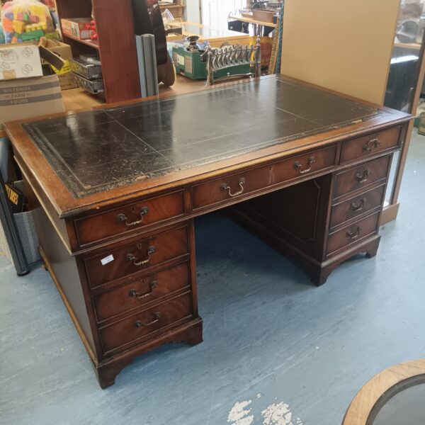Antique mahogany leather top desk with drawers.