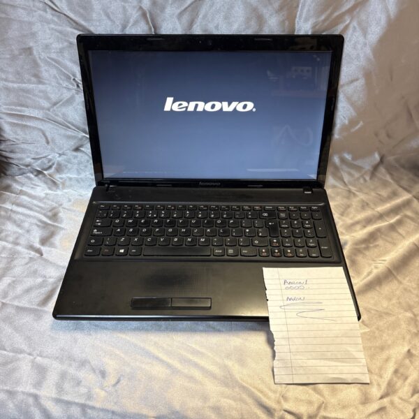 Black Lenovo 2181 vintage laptop, open on a desk.