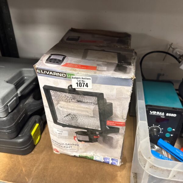 Pair of used Livarno Lux energy saving floodlights for outdoor lighting.